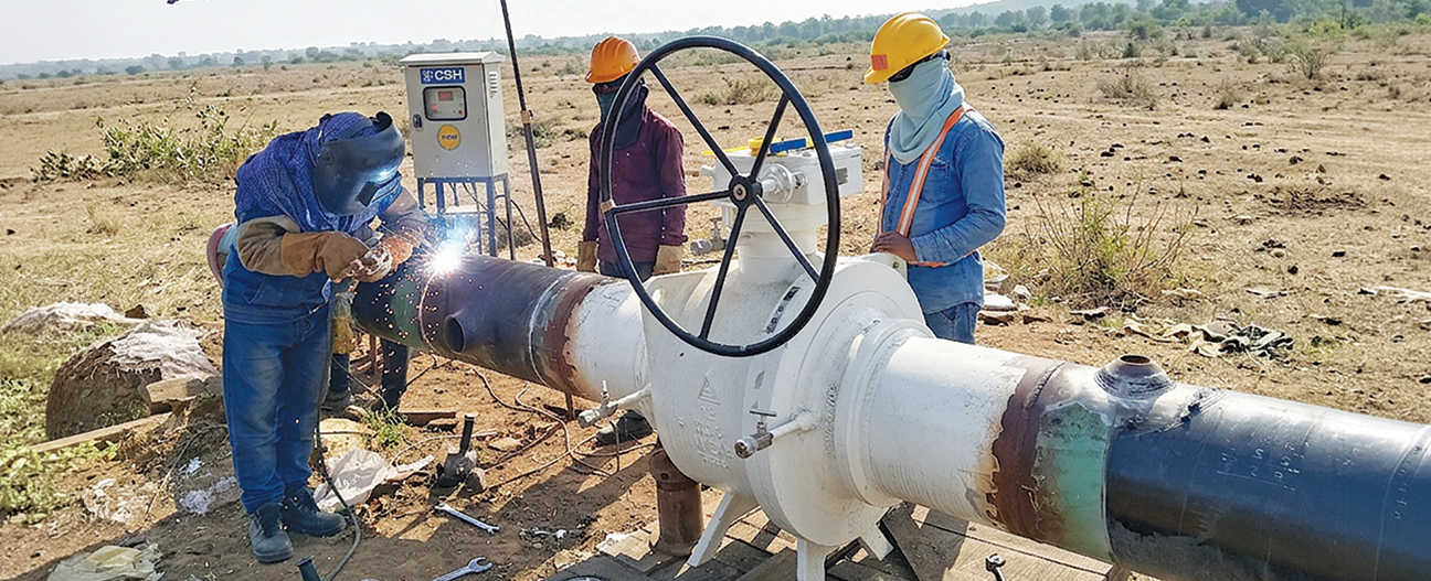 ATGL team laying steel pipeline